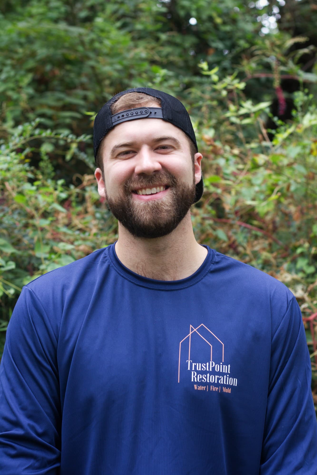 Riley of TrustPoint Restoration, in a TrustPoint shirt
